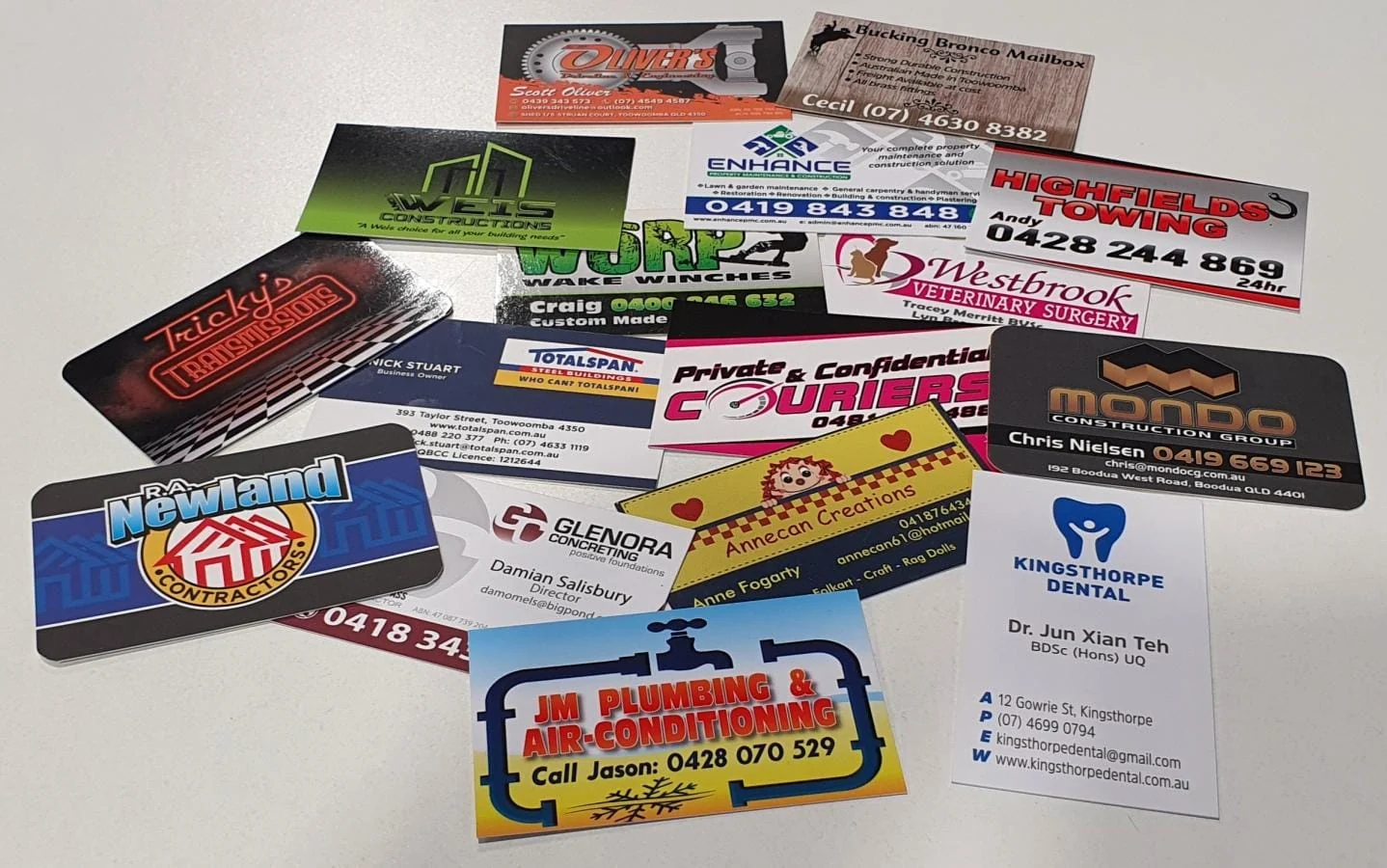 Spread of printed business cards for local clients