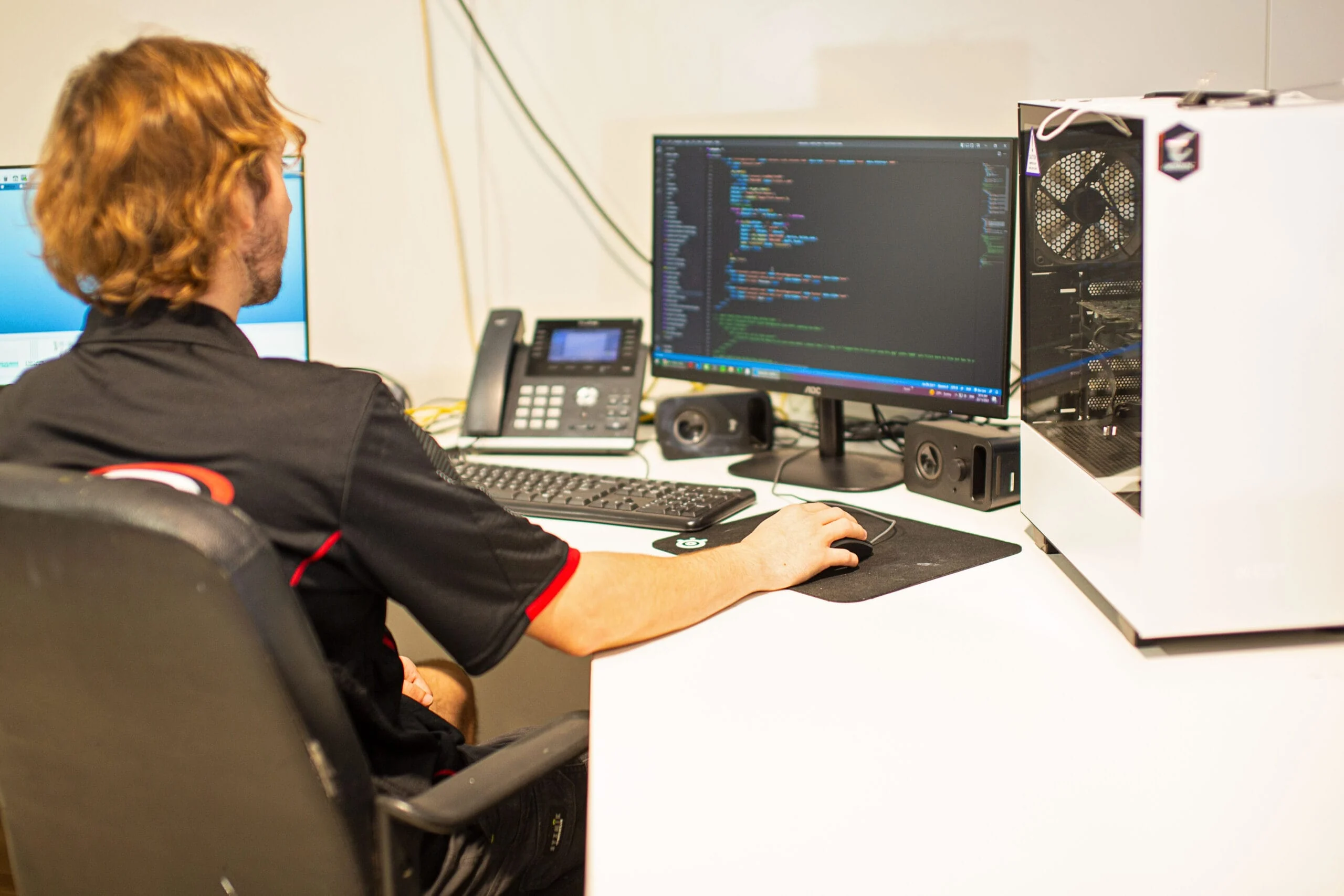ALE web developer coding a client website